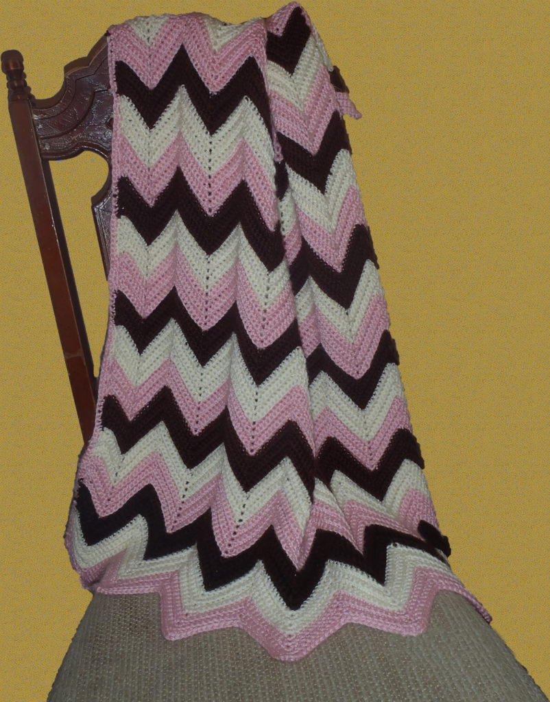 pink brown and white zig zag crochet blanket