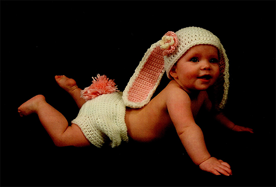 baby girl wearing a crocheted Bunny Diaper Cover and Hat