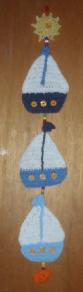 crocheted sailboat wall hanging